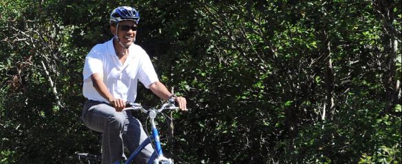 US President Barack Obama rides his bicy