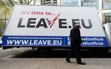 A man walks past a campaign poster ahead of a press briefing by the "Leave.EU" campaign group in central London on November 18, 2015. Britain will decide in a referendum to be held by 2017 if they should remain within the European Union. AFP PHOTO / LEON NEAL        (Photo credit should read LEON NEAL/AFP/Getty Images)
